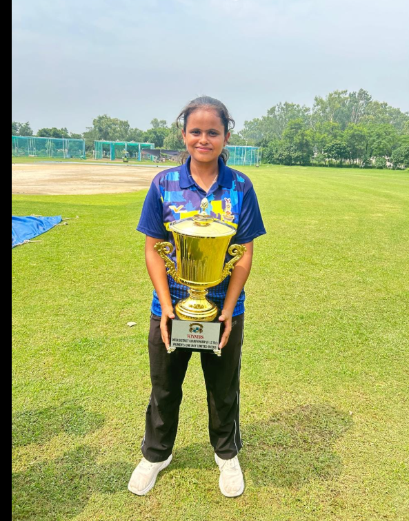 Students of Lucky Public School celebrating victory at the Annual Sports Day Championship, holding trophies and medals with pride and team spirit.