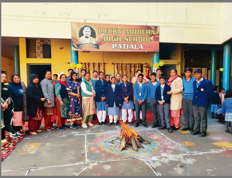 Students and staff of Lucky Public School celebrating Lohri with traditional attire, bonfire, music, and joyful cultural performances.